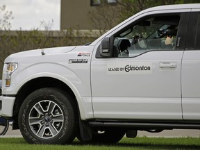 A photo radar operator monitors traffic on Saskatchewan Drive near 86 Avenue on Wednesday May 17, 2017.