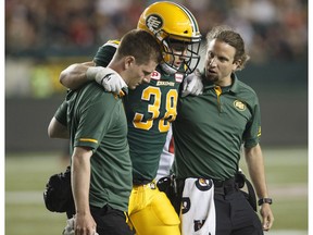 Edmonton Eskimos' Adam Konar (38) is injured against the Ottawa Redblacks during second half CFL action in Edmonton, Alta., on Friday July 14, 2017.