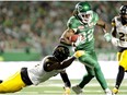 Saskatchewan Roughriders wide receiver Naaman Roosevelt (82) shakes a tackle during second half CFL football action against the Hamilton Tiger-Cats in Regina on Saturday, July 8, 2017.