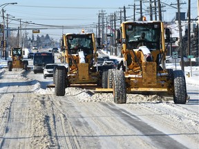 A team of graders clearing snow along 52 Avenue near 97 Street in this 2016 file photo.