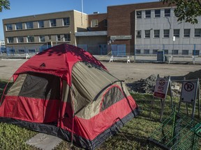 A tent is pitched on the grounds of the Herb Jamison Centre in downtown Edmonton. The city is seeking solutions for people who are sleeping rough.