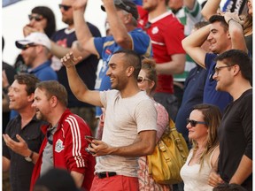 FC Edmonton fans cheer during a NASL soccer game between FC Edmonton and North Carolina FC at Clarke Stadium in Edmonton on Friday, July 7, 2017.