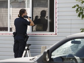 An Edmonton Police Service officer investigates an overnight aggravated assault in the Evergreen Community in Edmonton on Thursday, July 13, 2017.