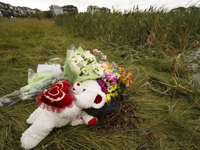 A memorial is seen next to a stormwater pond where Khrystyna Maksymova, 14, drowned in Edmonton on Monday, July 24, 2017.