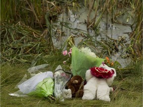 A memorial is seen next to a stormwater pond where Khrystyna Maksymova, 14, drowned is seen near 82 Street and Crystallina Nera Way in Edmonton on Monday, July 24, 2017.