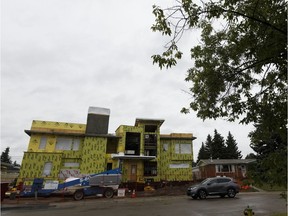 Owner John Douglas Kennedy MacDonald demolished two bungalows to build a new single family house, under construction on July 24, 2017, next to a park at 11427 48 Avenue in Edmonton.