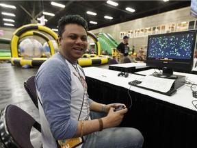 Game developer Mike Mattai plays his game Voxeltron 1982 at the GDX Game Discovery Exhibition inside the TechLife hall at K-Days at Northlands in Edmonton on Tuesday, July 25, 2017.