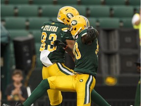 Edmonton's Brandon Zylstra (83) celebrates a touchdown with Chris Williams (80) during a CFL game between the Edmonton Eskimos and the BC Lions at Commonwealth Stadium in Edmonton on Friday, July 28, 2017.