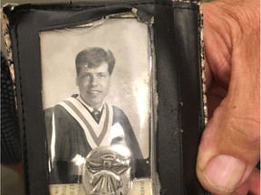 Don Szybunka holds his son Klayten's high school graduation photo after a Law Enforcement Review Board hearing in Edmonton on July 7, 2017. Klayten Szybunka, 37, died shortly after being released from police custody for a public intoxication ticket on June 28, 2014.