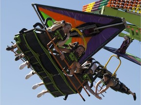 Riders at K-Days take a cruise on the Cliff Hanger on Wednesday July 26, 2017, in Edmonton.