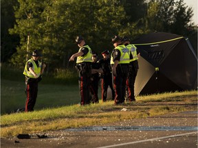 Police investigate the scene of a crash on the off ramp of the Anthony Henday Drive going onto Whitemud Drive on Monday July 3, 2017, in Edmonton.