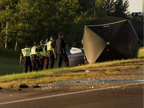 Police investigate the scene of a crash on the off-ramp of the Anthony Henday Drive going onto Whitemud Drive on Monday July 3, 2017, in Edmonton.