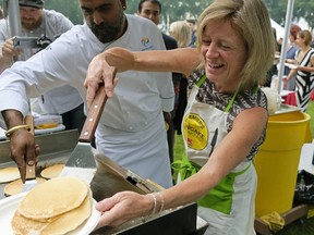 Alberta Premier Rachel Notley serves pancakes at the annual Premier's K-Days breakfast held on the grounds of the Alberta Legislature on Thursday July 20, 2017.
