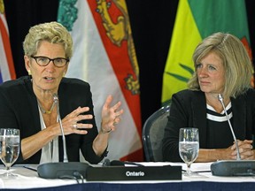 Kathleen Wynne (left, Premier of Ontario) and Rachel Notley (right, Premier of Alberta) at the closing news conference after a three-day meeting with Canada's provincial Premiers and National Indigenous Organization Leaders in Edmonton on Wednesday July 19, 2017.