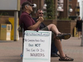Dave Bona protests outside Canada Place on Wednesday, July 19, 2017, in Edmonton, against soldiers being prescribed the antimalarial drug mefloquine. He said he has suffered many side effects after taking the drug while in the military.