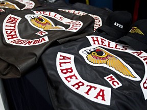 Police show off items, confiscated during 10 search warrants that were executed at Hells Angels clubhouses in Alberta, at K Division headquarters in Edmonton, Alta., on April 25, 2014.