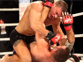 Edmonton's Miles Anstead lands a punch to the face of fellow Edmontonian Jared McComb at MFC: 41 All In at the Shaw Conference Centre in Edmonton, AB on Oct. 3, 2014.