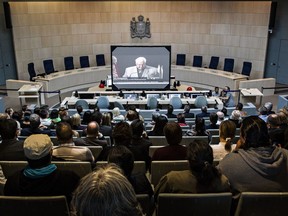 People pack the Edmonton council chambers to watch the live broadcast of the Truth and Reconciliation Commission's release of its final report in Edmonton on Tuesday, June 2, 2015.