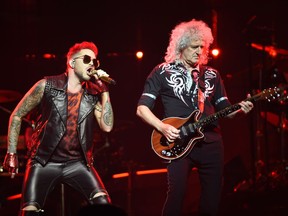 Brian May of Queen and Adam Lambert (L) in concert at Rogers Place in Edmonton, July 4, 2017.