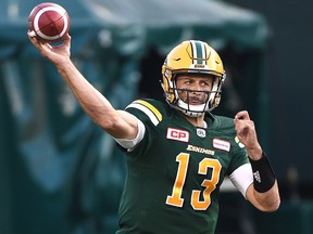 Edmonton Eskimos quarterback Mike Reilly (13) throws a pass against the Ottawa Redblacks during CFL action at Commonwealth Stadium in Edmonton, July 14, 2017. Ed Kaiser/Postmedia