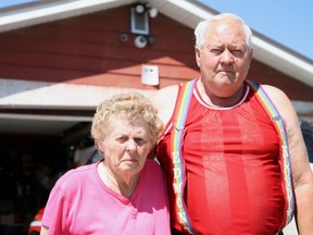 Jean and Noel Sanderson stand in front of the security cameras behind their house near 77 Street and 141 Avenue in Edmonton, Alta. that they installed after being the victims of a string of thefts and vandalisms. Noel Sanderson says they have been victimized more than 50 times since moving into their home in 1990.