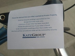 A note stuck to a bicycle parked in front of Edmonton Tower Thursday evening has brought attention to the lack of bike racks in the city's downtown core.