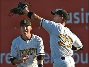 Edmonton Prospects Jake Lanferman (22) about to make the catch for an out as Dean Olson (15) looks on in the outfield against the Lethbridge Bulls during Western Major Baseball League action at Re/Max Field in Edmonton, July 6, 2017.