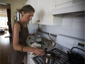 Food writer and NAIT professor Kristine Kowalchuk prepares a lemon pudding from her new book, Preserving on Paper.