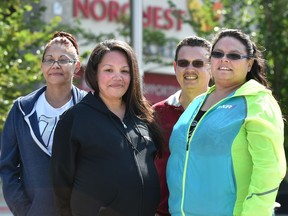 Student Beth Sunshine, left, student Farrah Mitchell, graduate Greg Heard and student Kandis Mitchell were at the Alberta Indigenous Construction Career Centre at NorQuest College in Edmonton, on Aug. 15, 2017 when it was announced the federal-provincial governments will grant $1.9 million to support a program for Indigenous people to get trained and find jobs in construction.