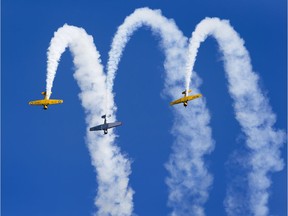 Three Harvard airplanes fly at the Edmonton Airshow on Saturday August 19, 2017, at the Villeneuve Airport.