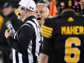 Hamilton Tiger-Cats special teams co-ordinator Jeff Reinebold yells at a referee following an attempted on-side kick by the Hamilton Tiger-Cats late in the second-half of CFL football action against the Edmonton Eskimos in Hamilton on October 28, 2016. The winless Hamilton Tiger-Cats shook up their coaching staff on Tuesday by replacing defensive co-ordinator Reinebold. THE CANADIAN PRESS/Peter Power