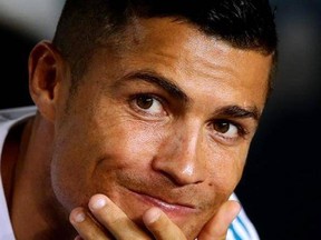 Real Madrid&#039;s Cristiano Ronaldo on the bench prior to the Spanish Supercup, first leg, soccer match between FC Barcelona and Real Madrid at the Camp Nou stadium in Barcelona, Spain, Sunday, Aug. 13, 2017. (AP Photo/Manu Fernandez)