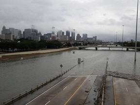 The downtown Houston skyline and flooded Highway 288 are seen on Aug. 27, 2017, as the city battles with tropical storm Harvey and resulting floods.