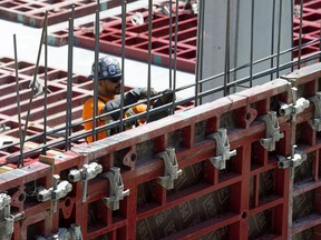 Construction crews work in the Ice District, in downtown Edmonton Wednesday July 5, 2017.