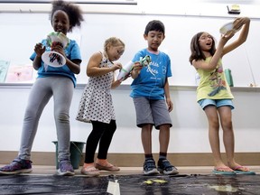 Rockin' Docs summer camp participants react after testing the protective egg housings they created while conducting egg drop experiments at the Edmonton Health Clinic Academy, 11405 87 Ave., in Edmonton on Thursday Aug. 3, 2017.