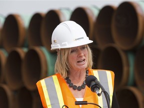 Premier Rachel Notley speaks to the media during a stop at a pipeline stockpile site for Enbridge's Line 3 pipeline replacement project, near Hardisty Thursday, Aug. 10, 2017.