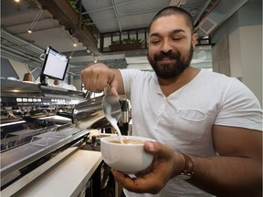 Owner Jorel Pepin makes a latte at the newly opened Monument Coffee, 10803 Jasper Avenue, in Edmonton Monday Aug. 14, 2017.