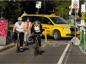 Cyclists ride in a bike lane on 102 Avenue earlier in this file photo.