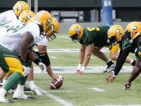 John Chick (centre right) takes part in Edmonton Eskimos practice at Commonwealth Stadium on Aug. 21, 2017.