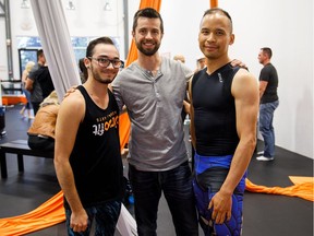 Instructors Aiden Lamb, left, Erik Luber and Herman Lau at CircoFit's one-year-anniversary party in Edmonton on Friday, Aug. 18, 2017.