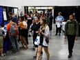 People make their way through Hall E during YOUth POWER's seventh annual career event at the Edmonton Expo Centre in Edmonton on Tuesday, May 30, 2017. (Codie McLachlan/Postmedia)