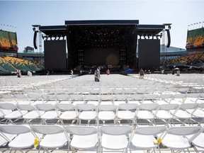 People set up chairs for Wednesday's Guns N' Roses concert at Commonwealth Stadium in Edmonton on Tuesday, August 29, 2017.