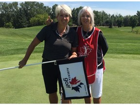 Kim Carrington, left, poses with her mother and caddie Shelley, Carrington-Jempson after winning the Alberta Senior Ladies Championship at the Edmonton Petroleum Golf and Country Club on Thursday, Aug. 3, 2017.