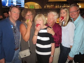 Hamming it up Saturday Aug. 19, 2017 after attending the Edmonton International Fringe Festival opening of The Apple Tree, The Diary of Adam and Eve, are ATB Financial president and CEO Dave Mowat, left, and his wife Sandy Mowat, Bob Westbury, Marilyn Westbury and retired TransAlta CEO Steve Snyder and his wife Jane. Westbury and Mowat hosted a celebratory dinner to mark the opening of the Fringe Festival season, where it was announced a $25,000 annual award would in future support a local emerging artist.