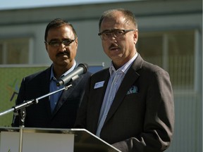 RMS Group president Curtis Way speaks at the ground turning ceremony for Pine Creek, a 174-unit apartment building and the first partnership of its kind with Capital Region Housing, While MP Amarjeet Sohi looks on.