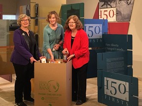 Marjorie Bencz, executive director of Edmonton's Food Bank, left, Leslie Latta, executive director of the Provincial Archives of Alberta, and Denise Woollard, MLA for Edmonton-Mill Creek, launch the '150 for 150' food drive in Edmonton on Tuesday, Aug. 22, 2017.
