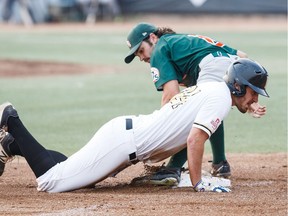 Edmonton's Anthony Cusati (24) makes it to third base before Swift Current's Riley Campbell (8) can tag him out during Game 4 of the WMBL final playoff series between the Edmonton Prospects and the Swift Current 57s at Re/Max Field in Edmonton on Wednesday, Aug. 16, 2017.