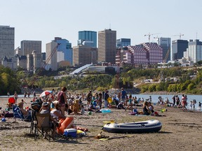 People enjoy a hot summer day on "Accidental Beach" in Edmonton on Tuesday, August 29, 2017. (Codie McLachlan/Postmedia)
