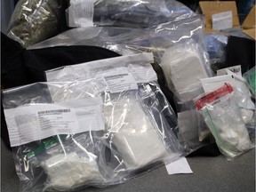 Stony Plain/Spruce Grove/Enoch RCMP seized nearly $700,000 worth of drugs, including carfentanil, two guns, $45,000 in cash, a silver bar and gold coins from a residence in west Edmonton on Friday, Aug. 25, 2017. Daniel Gleason, 28, and brother Kevin Gleason, 22, were arrested and are facing charges.