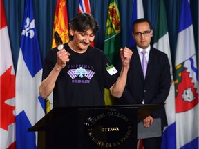 Jerry Natanine, community leader and former mayor of Clyde River, speaks during a press conference on Parliament Hill following a ruling at the Supreme Court of Canada in Ottawa on Wednesday, July 26, 2017. Clyde River's legal counsel Nader Hasan looks on.